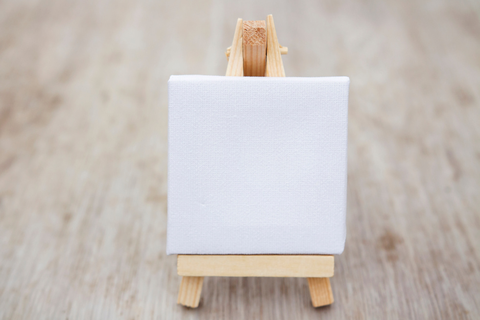 Easel. Mini small easel for drawing on canvas with paints.